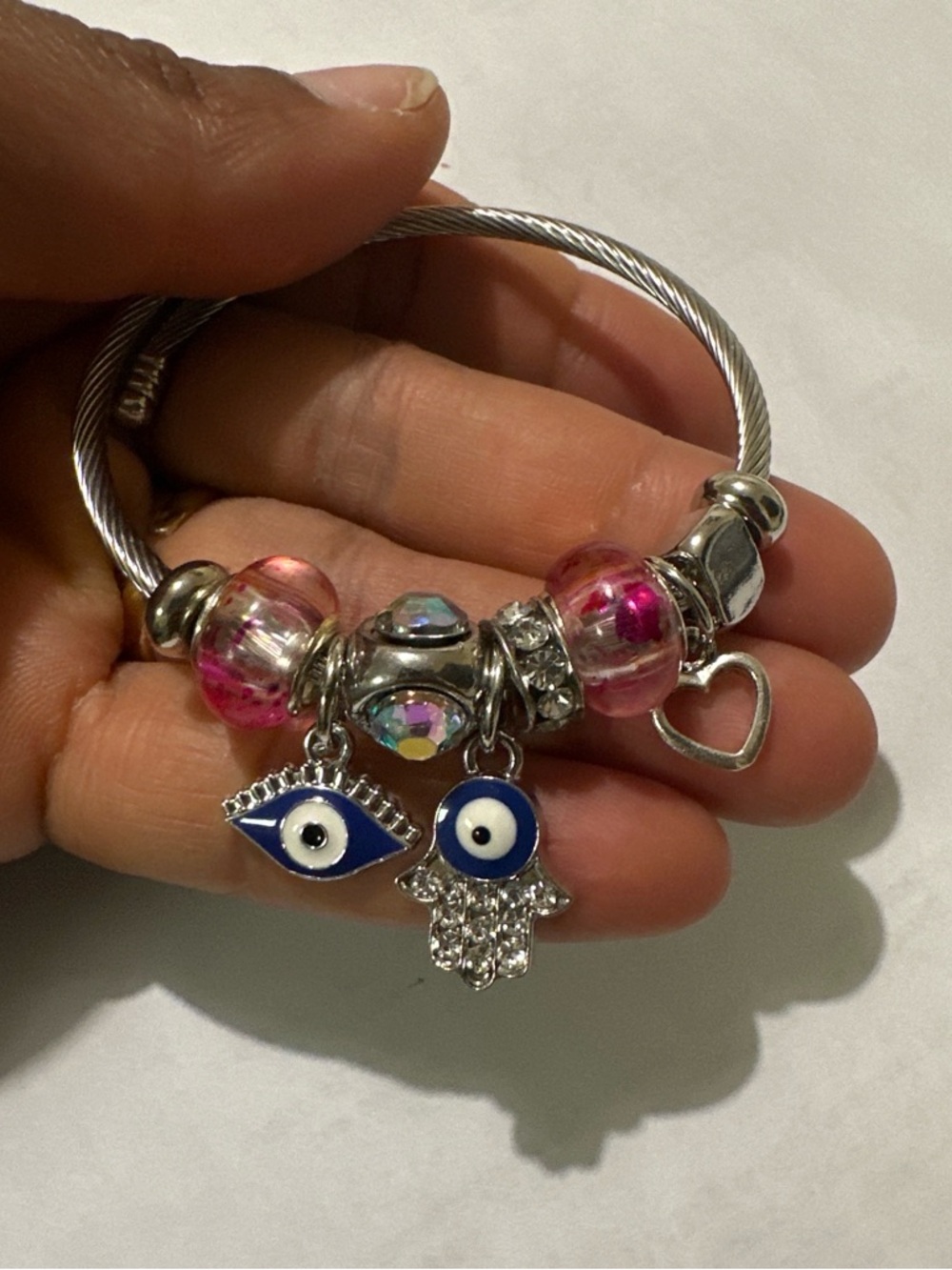Silver Charm Bangle Bracelet with Pink Glass Beads and Blue Evil Eye Charms